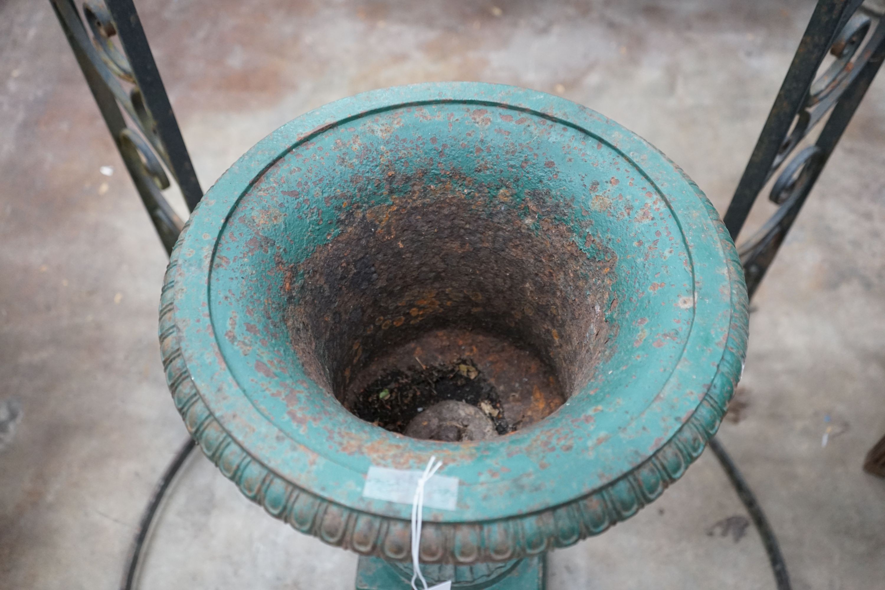 A Victorian painted cast iron campana garden urn on square pedestal stand, diameter 40cm, height 80cm